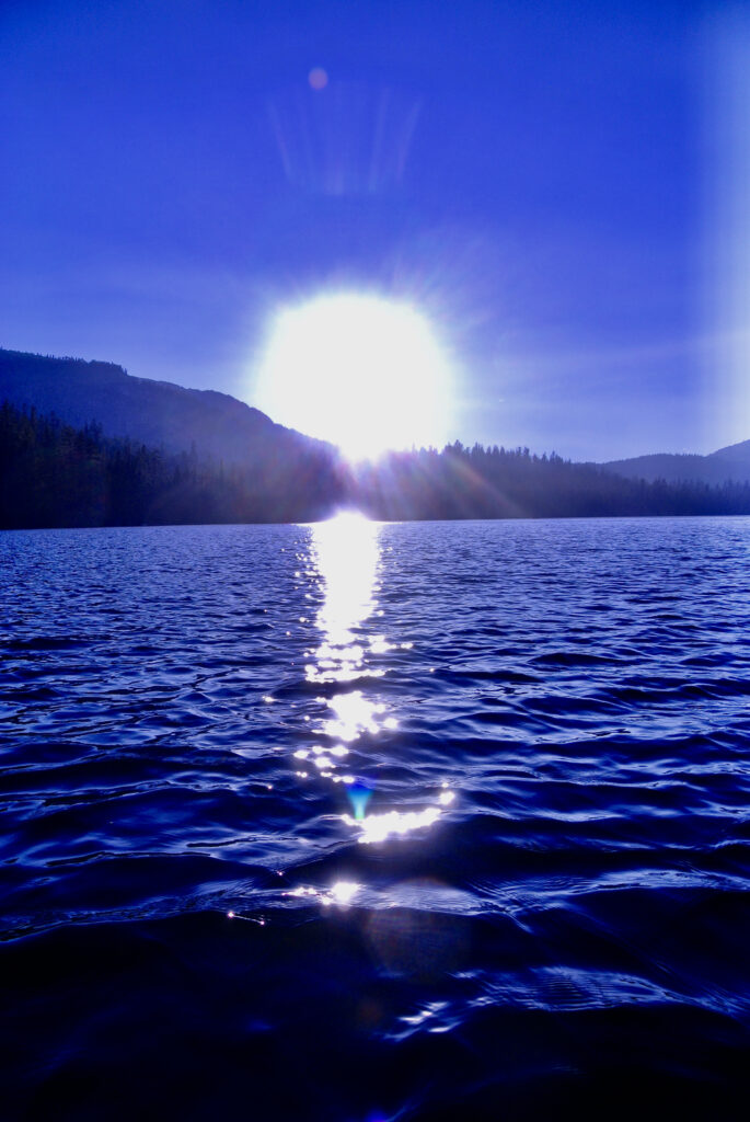 The sun reflecting on the waters of the lake